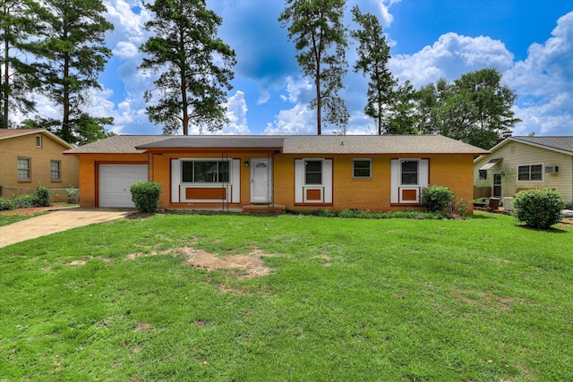 3414 Forest Estates Dr, Augusta, GA 30909 - single story home with an attached garage, concrete driveway, a front lawn, and brick siding