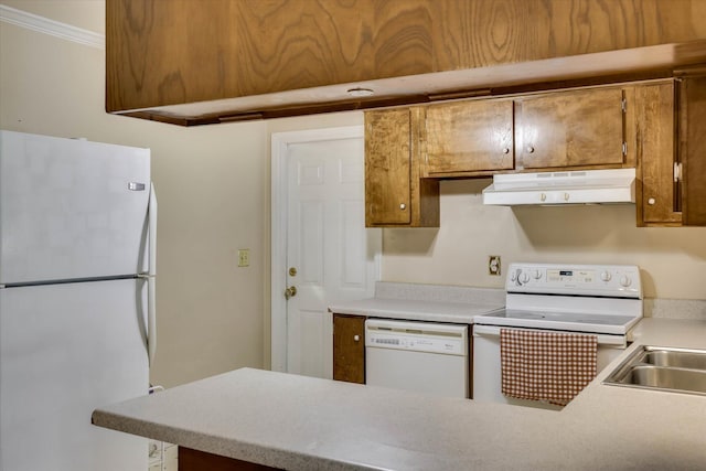 3414 Forest Estates Dr, Augusta, GA 30909 - kitchen with white appliances, under cabinet range hood, a peninsula, light countertops, and brown cabinetry