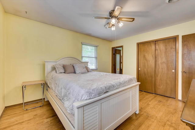 3414 Forest Estates Dr, Augusta, GA 30909 - bedroom with light wood-style floors, a ceiling fan, and two closets