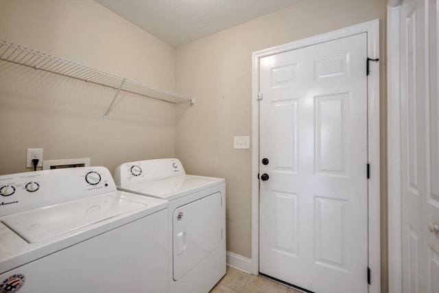 3113 Sunset Maple Trl, Evans, GA 30809 - laundry area with washing machine and clothes dryer and light tile patterned floors