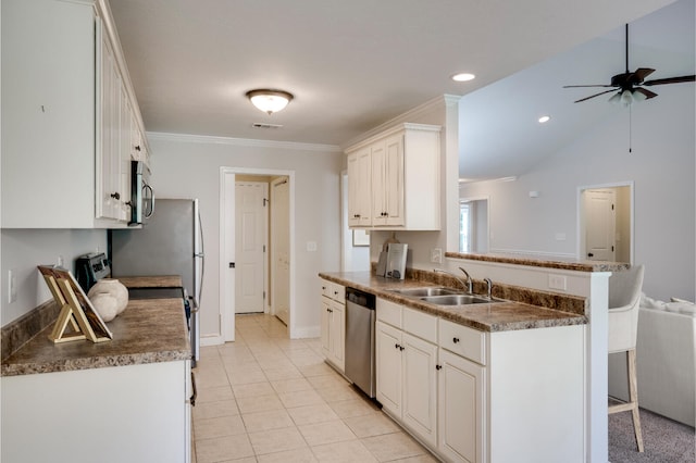 3113 Sunset Maple Trl, Evans, GA 30809 - kitchen featuring appliances with stainless steel finishes, a breakfast bar area, ceiling fan, dark countertops, and white cabinets