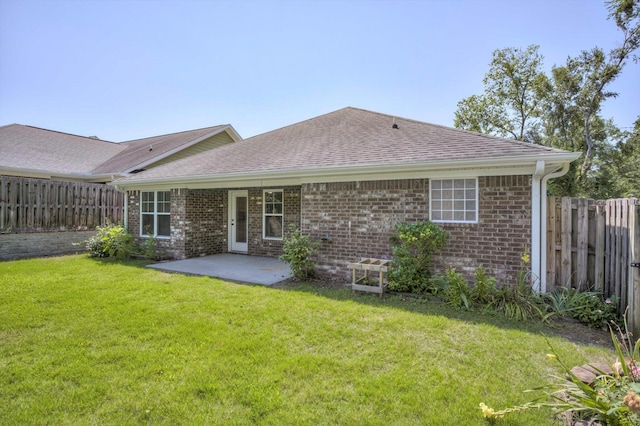 3113 Sunset Maple Trl, Evans, GA 30809 - rear view of house with brick siding, roof with shingles, a fenced backyard, and a patio area