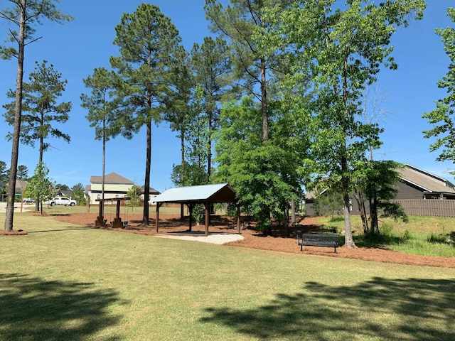 view of property's community featuring a yard and a gazebo