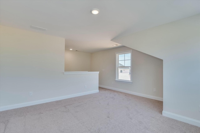 bonus room with recessed lighting, carpet floors, and baseboards