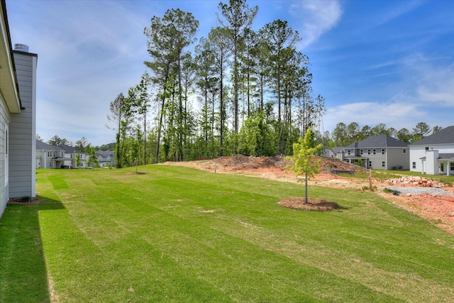 view of yard featuring a residential view
