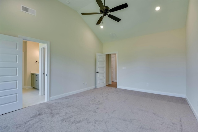 unfurnished bedroom with high vaulted ceiling, baseboards, carpet, and visible vents