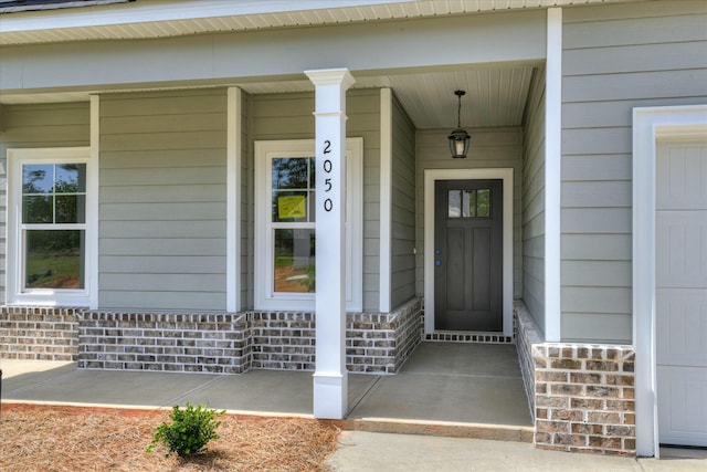 property entrance featuring a porch