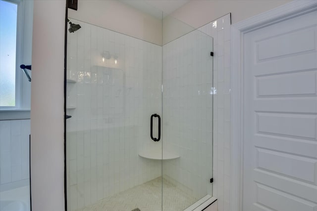 bathroom featuring a shower stall