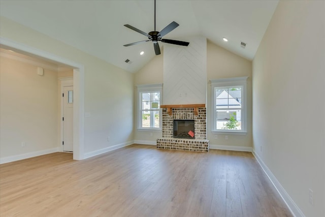 unfurnished living room with ceiling fan, wood finished floors, visible vents, and a healthy amount of sunlight