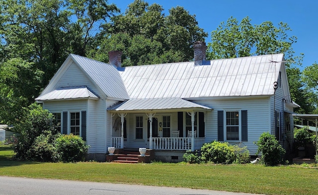 view of front of home with covered porch and a front yard