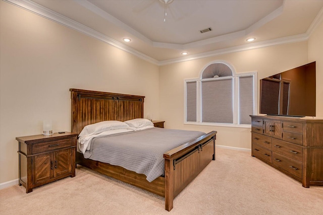 bedroom featuring recessed lighting, light colored carpet, visible vents, baseboards, and a tray ceiling