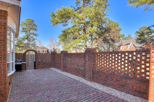 view of patio / terrace with a gate and fence