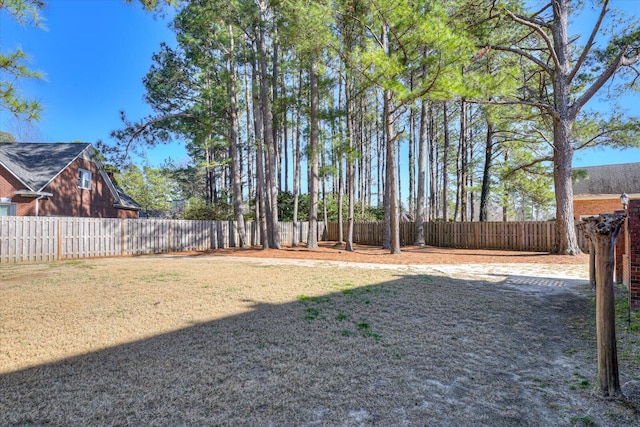 view of yard with a fenced backyard