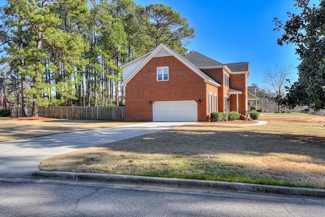 view of property exterior featuring a garage, brick siding, fence, concrete driveway, and a yard