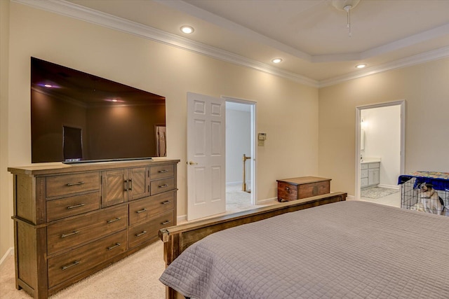 bedroom with connected bathroom, recessed lighting, light carpet, a raised ceiling, and crown molding