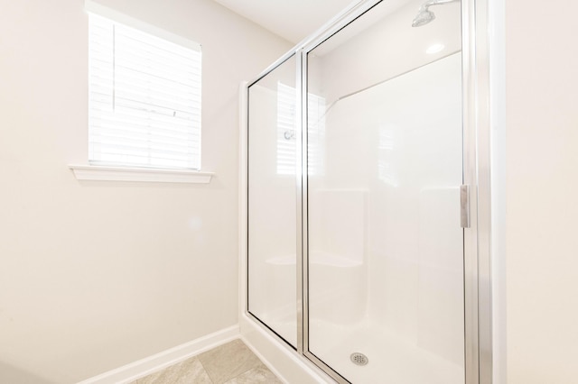 bathroom featuring tile patterned floors and walk in shower