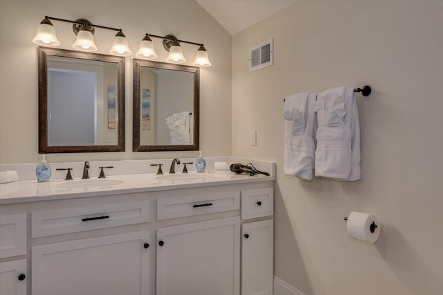 1020 Peninsula Xing, Evans, GA 30809 - bathroom featuring double vanity and vaulted ceiling