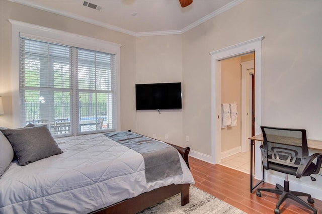 1020 Peninsula Xing, Evans, GA 30809 - bedroom with ornamental molding, multiple windows, wood finished floors, baseboards, and ceiling fan