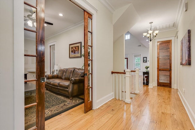 1020 Peninsula Xing, Evans, GA 30809 - hallway with light wood-style flooring, ornamental molding, a chandelier, an upstairs landing, and baseboards