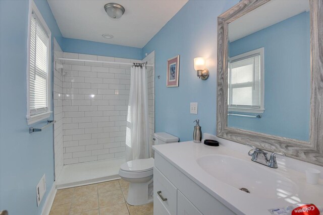 carpeted bedroom with ceiling fan, connected bathroom, and a closet