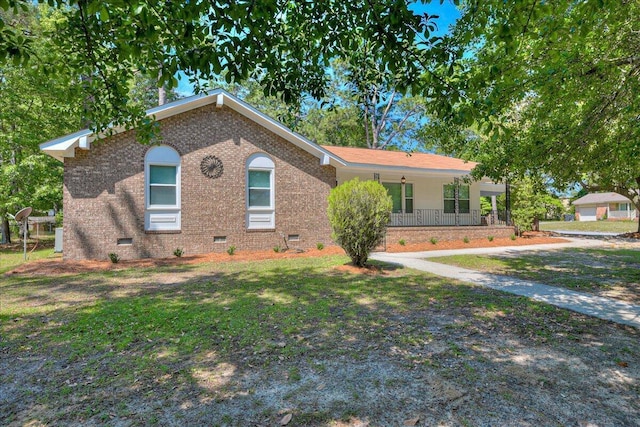 ranch-style house featuring brick siding, a porch, and crawl space