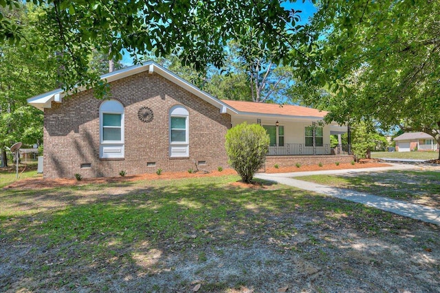 single story home featuring covered porch