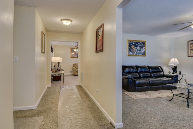 corridor with light colored carpet