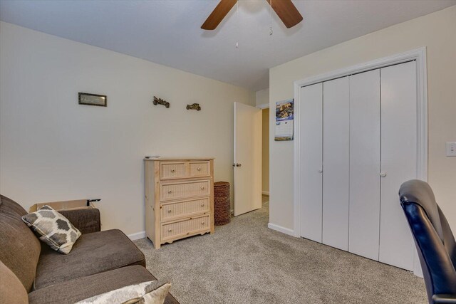 home office with ceiling fan and light colored carpet