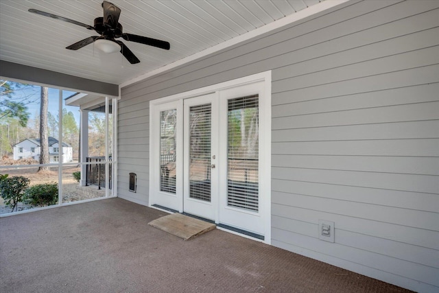 unfurnished sunroom with ceiling fan and wooden ceiling