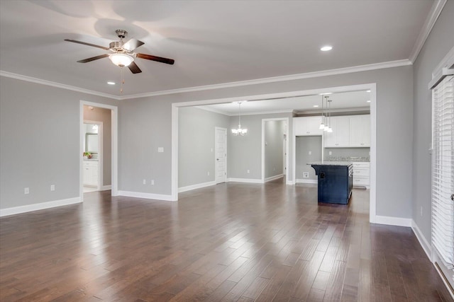 unfurnished living room with ceiling fan with notable chandelier, dark wood-type flooring, and crown molding