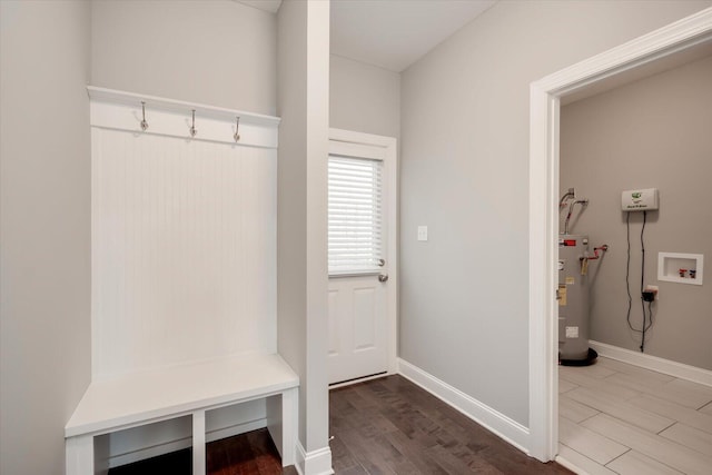 mudroom featuring electric water heater and hardwood / wood-style flooring