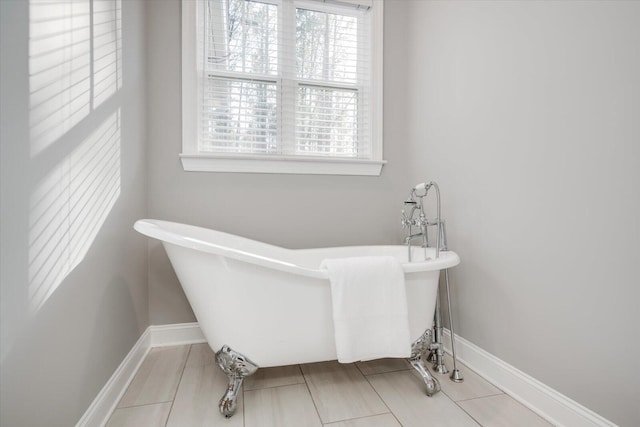 bathroom with a wealth of natural light and a bathing tub