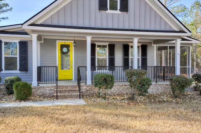 view of front of property with covered porch and a front yard