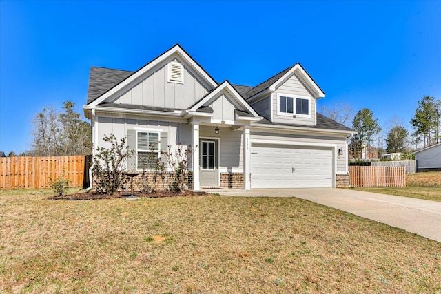 view of front of property with a front lawn, driveway, fence, board and batten siding, and brick siding