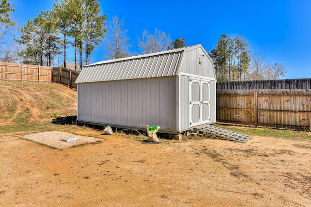 view of shed with a fenced backyard