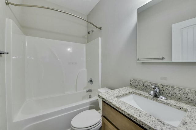 full bath with vanity, toilet, and shower / washtub combination