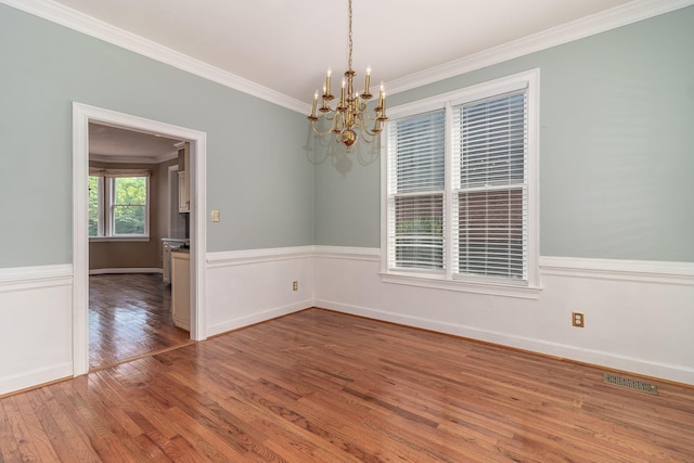 2531 Tupelo Dr, Augusta, GA 30909 - unfurnished room with a chandelier, wood finished floors, and ornamental molding
