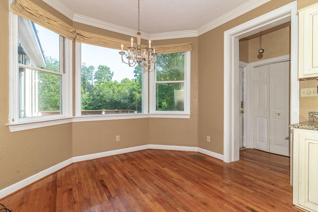 2531 Tupelo Dr, Augusta, GA 30909 - unfurnished dining area with a chandelier, light wood-type flooring, and crown molding