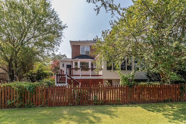 2531 Tupelo Dr, Augusta, GA 30909 - rear view of house with a wooden deck and stairway