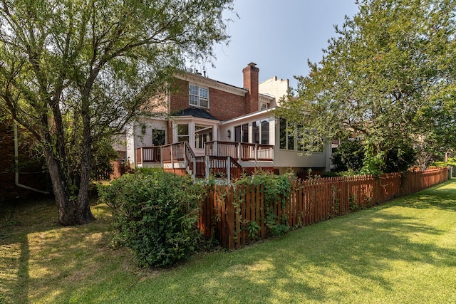 2531 Tupelo Dr, Augusta, GA 30909 - back of house featuring a wooden deck, a sunroom, a chimney, and stairs