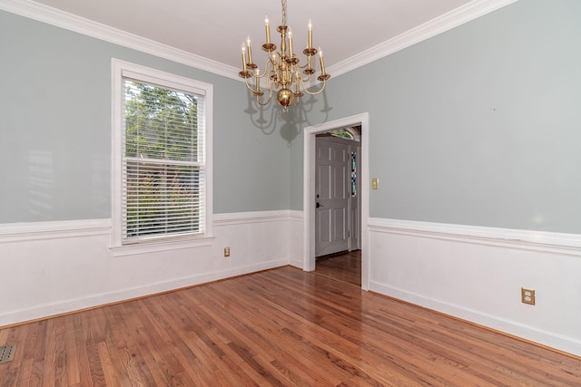 2531 Tupelo Dr, Augusta, GA 30909 - unfurnished room with a chandelier, wood finished floors, and crown molding