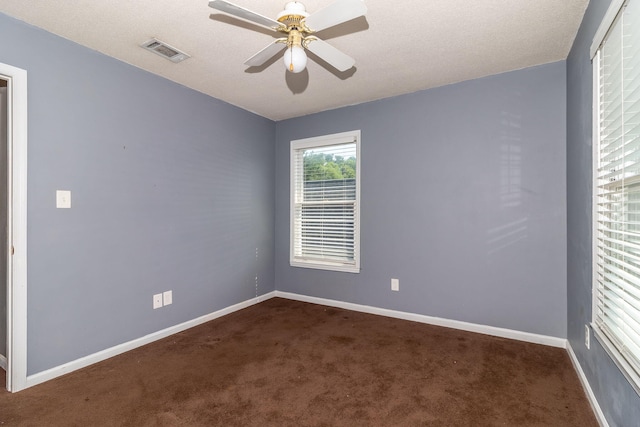 2531 Tupelo Dr, Augusta, GA 30909 - empty room featuring dark colored carpet and ceiling fan