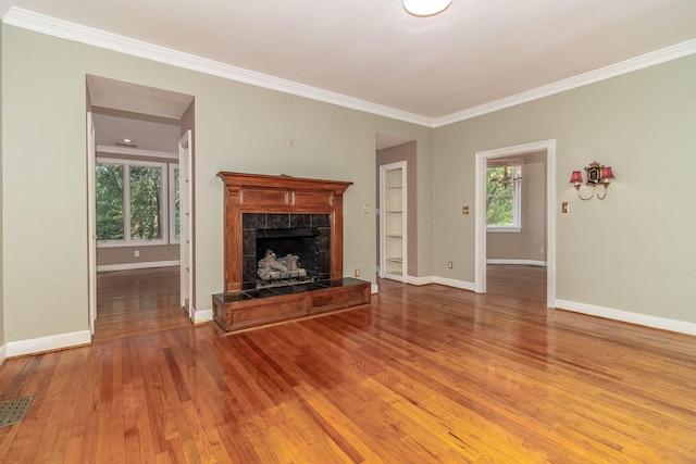 2531 Tupelo Dr, Augusta, GA 30909 - unfurnished living room featuring a fireplace, wood finished floors, and ornamental molding