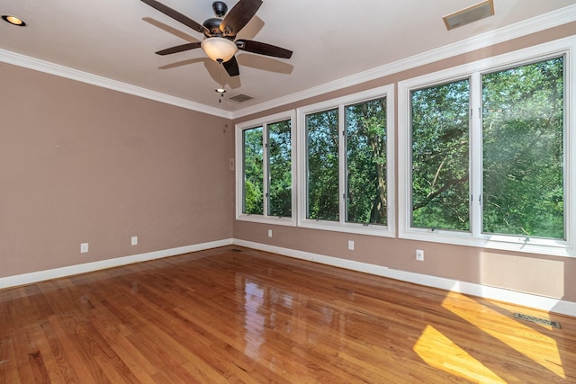 2531 Tupelo Dr, Augusta, GA 30909 - unfurnished room with healthy amount of natural light, a ceiling fan, wood finished floors, and crown molding