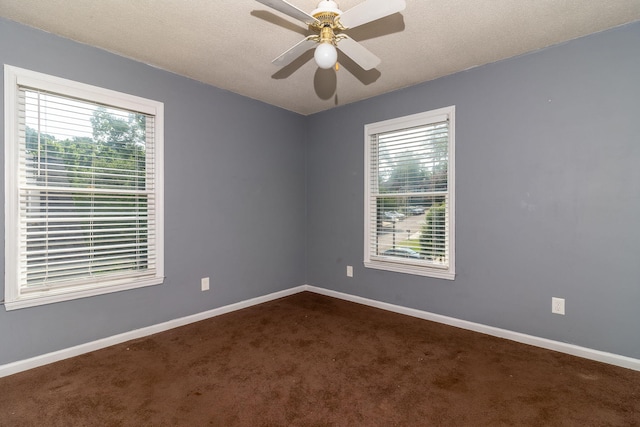 2531 Tupelo Dr, Augusta, GA 30909 - spare room featuring healthy amount of natural light, dark colored carpet, and a ceiling fan