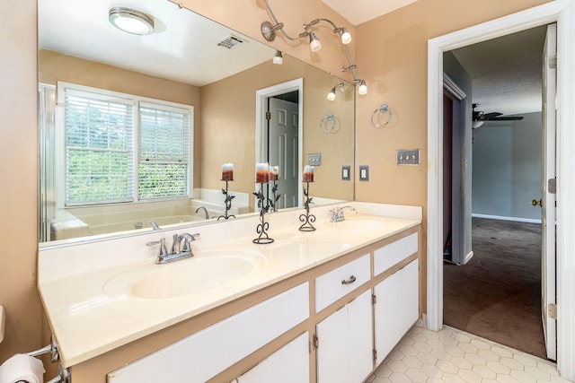 2531 Tupelo Dr, Augusta, GA 30909 - full bathroom with double vanity, tile patterned floors, and a tub
