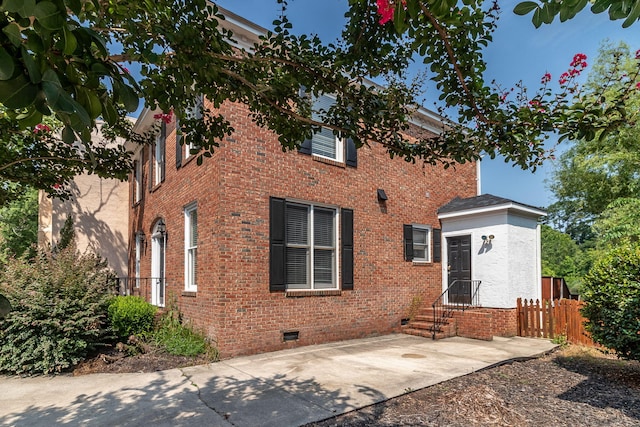 2531 Tupelo Dr, Augusta, GA 30909 - back of property with crawl space, brick siding, entry steps, and a patio area