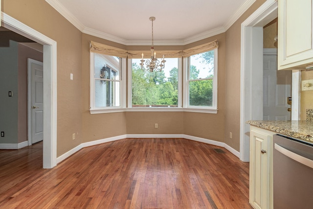 2531 Tupelo Dr, Augusta, GA 30909 - unfurnished dining area featuring a chandelier, light wood-style floors, and crown molding