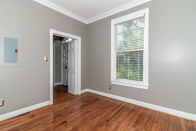 2531 Tupelo Dr, Augusta, GA 30909 - empty room featuring electric panel, crown molding, and wood finished floors