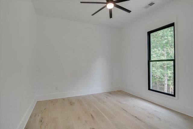 unfurnished room featuring light wood-type flooring, ceiling fan, and a healthy amount of sunlight